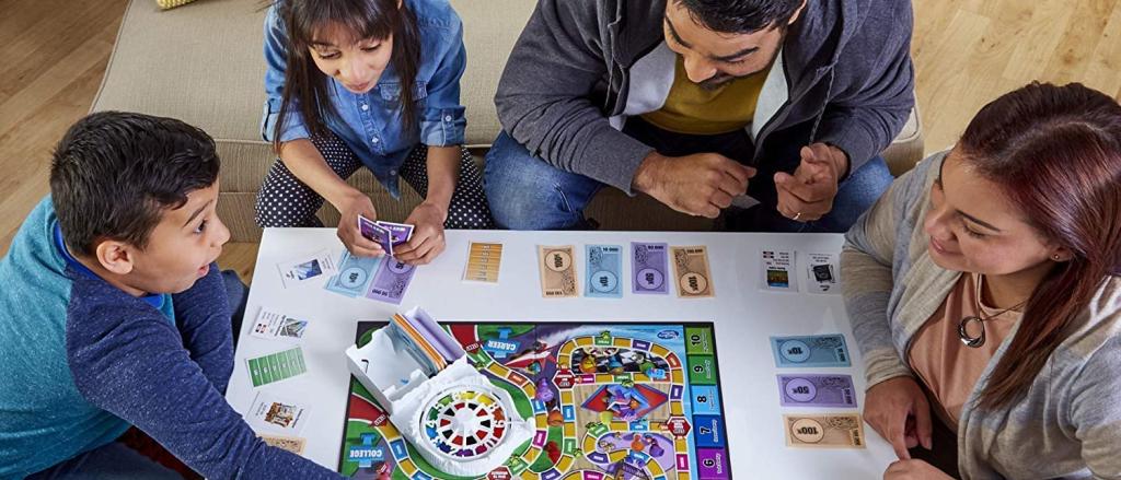 family playing Life board game